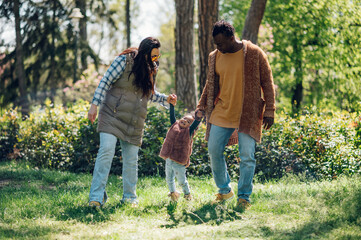 Multiracial family having fun in the park