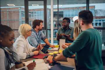 Multiracial business team working together and having a meeting in the office
