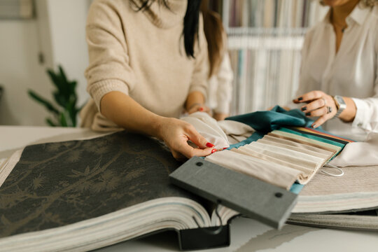 Anonymous Women Choosing Fabric