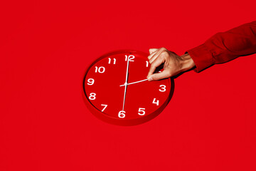man resets a red clock