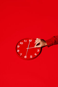 man resetting a red clock