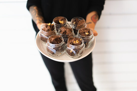 Waitress with tray of delicious brownies