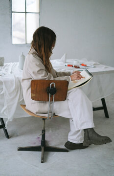 Portrait of Artist Drawing In Her Sketchbook 