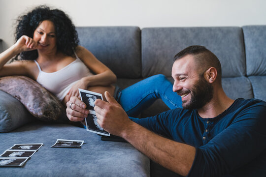 Happy Father with Baby Ultrasound Scans