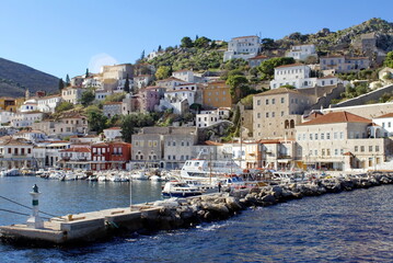 Naklejka na ściany i meble Town on the hill above the harbor on Hydra, Greek Isles