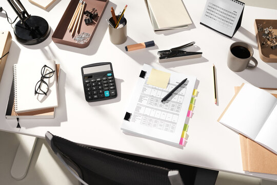 Work desk with documents calculator and office tools