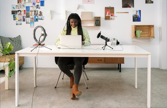 Content woman working in home studio