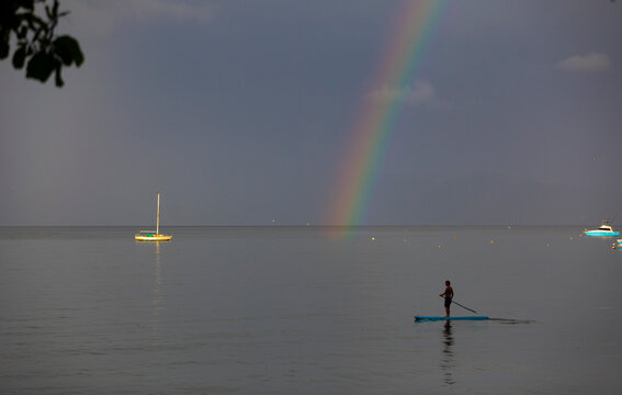 Rainbow on Ocean Horizon landscape in Costa Rica with Stand Up Paddle