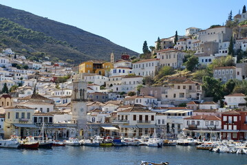 Fototapeta na wymiar Town on the hill above the harbor on Hydra, Greek Isles