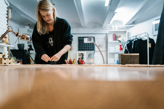 Female illustrator creating artwork in studio