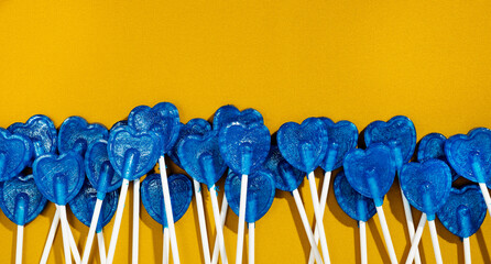 blue heart-shaped lollipops forming the flag of Ukraine