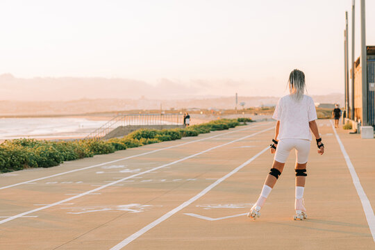 Back view of a woman roller skating