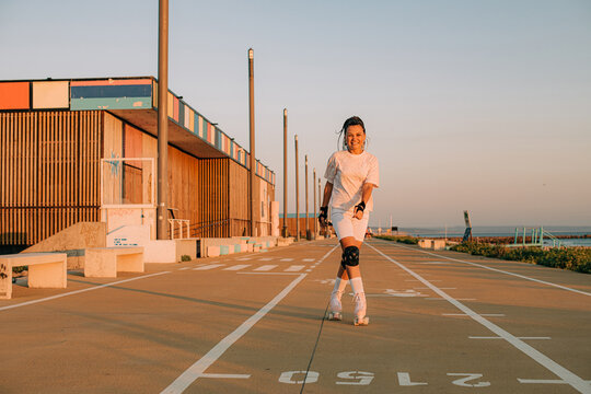 Female roller skater practicing in the seaside