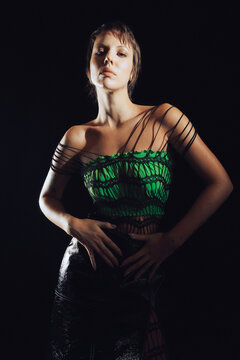 Top Model posing on black background.