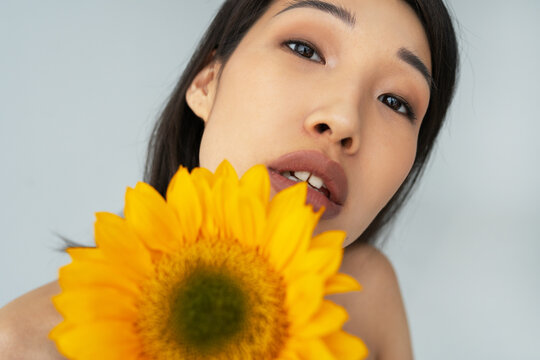 Closeup Portrait of Young Asian woman with flower