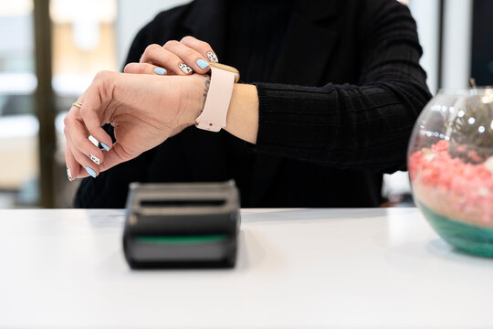 Unrecognizable woman checking smart watch