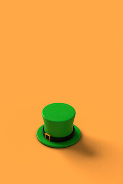 close up of green st.Patrick hats on orange background