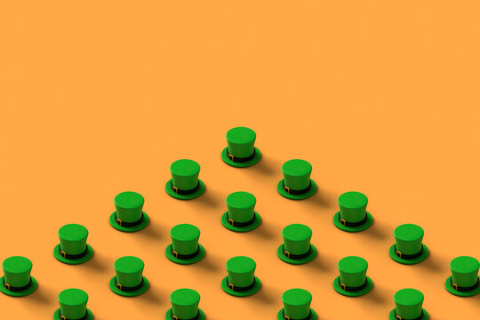 Collection of green st.Patrick hats on orange background