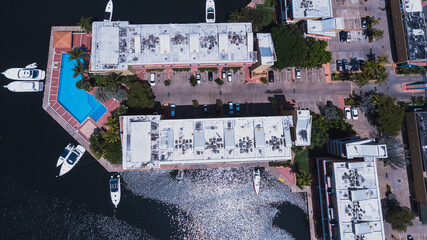 aerial drone shots of the beach city of Lecher&iacute;a, with a residential area of Venice-style stilt houses, you can see houses, editions, canals, houses on the sea, stilt houses, parking lots, swimming po