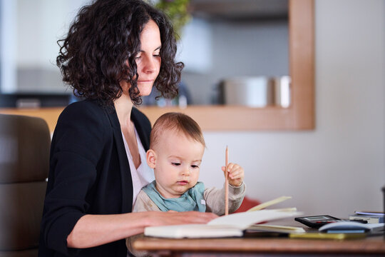Tired mother with son working