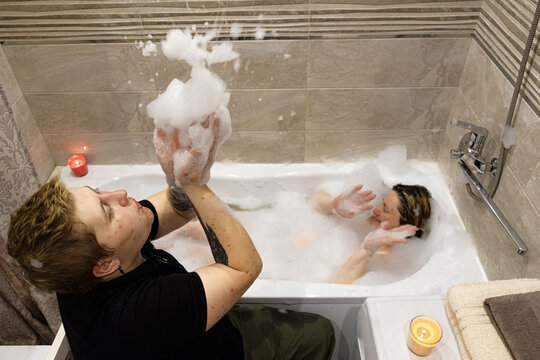 lgbtqia couple: Lgbt female pair in bath foam 