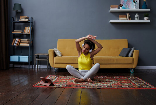 A woman does a stretch after a workout
