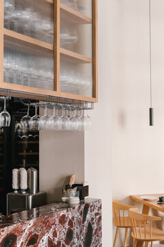 Counter with glassware and polishing machine in cafe