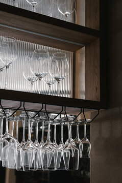 Rows of glasses on shelves in restaurant