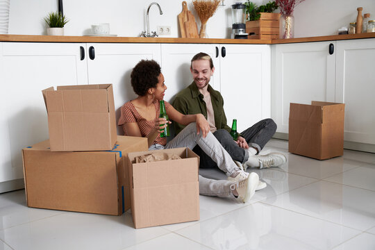 Young couple celebrates their move to a new apartment