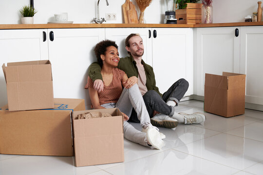 A young couple makes plans in a new apartment