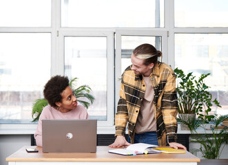 Employees confer on work
