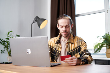 Man making online purchases during shopping