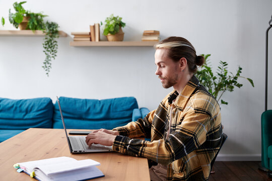 Young man working on his desk at the office