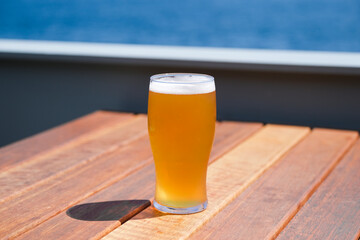 Summer time light beer by the coast