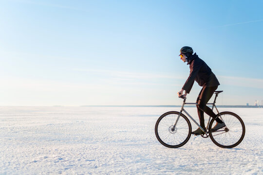 The rider on a bicycle rides on ice