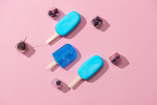 Group of ice pops and frozen fruit. Above view in a row 