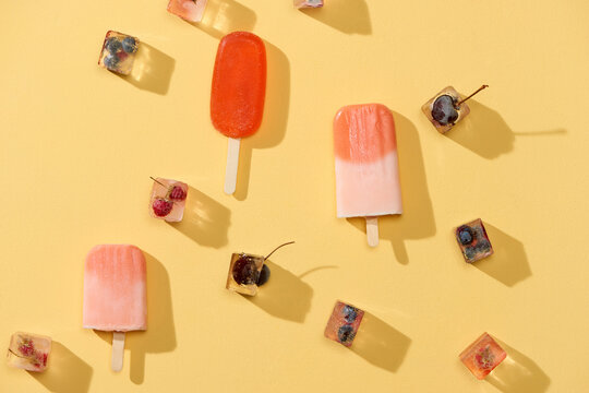 Homemade vegan raspberry, blueberry, and coconuts milk popsicle