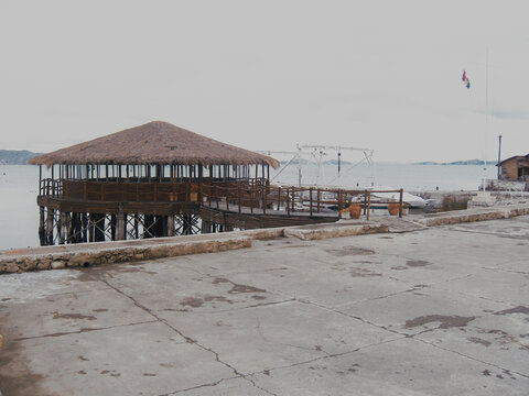 Lake Titicaca altiplano bolivia, highest lake in the world, chosa totora water customs rustic yesteryear boat background