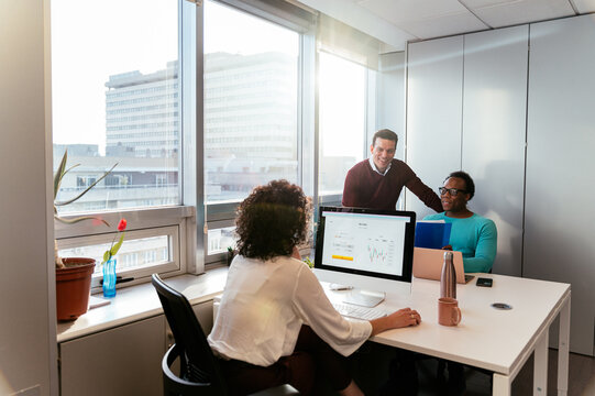 Group of colleagues working in office