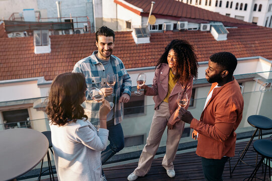 Happy diverse group having fun on terrace