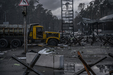Anti tank hedgehogs and burned cars on road