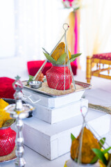 Indian Hindu wedding ceremony ritual items and hands close up