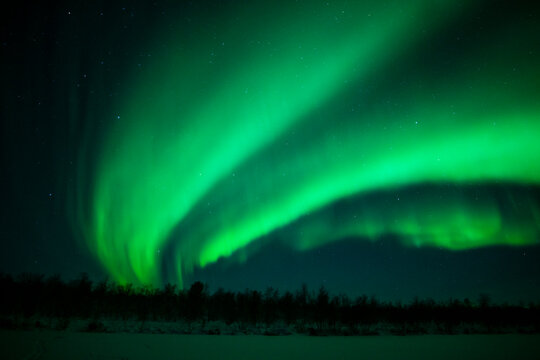 Northern Lights Creates a Display of Light and Color On the Starry Sky