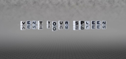 vent your spleen word or concept represented by black and white letter cubes on a grey horizon...