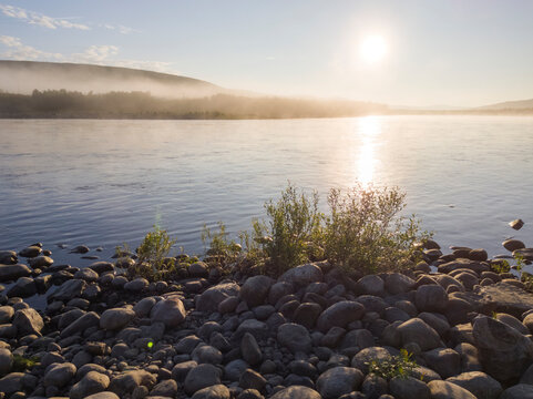 Midnight Sun Over a Misty River In the Far North of Finland