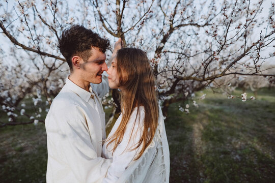man and woman walking in the garden