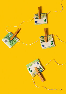 100 euro notes attached to a washing line