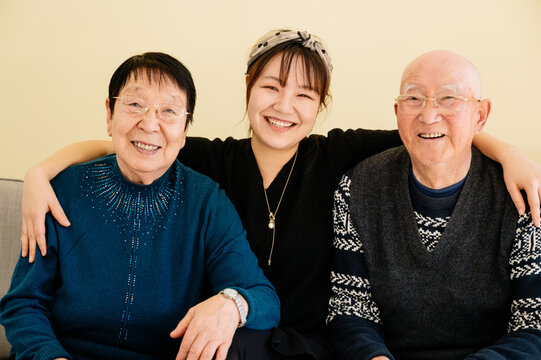 Portrait of grandparents and granddaughter