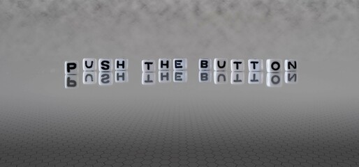 push the button word or concept represented by black and white letter cubes on a grey horizon...