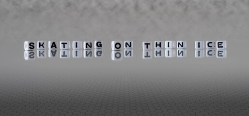 skating on thin ice word or concept represented by black and white letter cubes on a grey horizon...